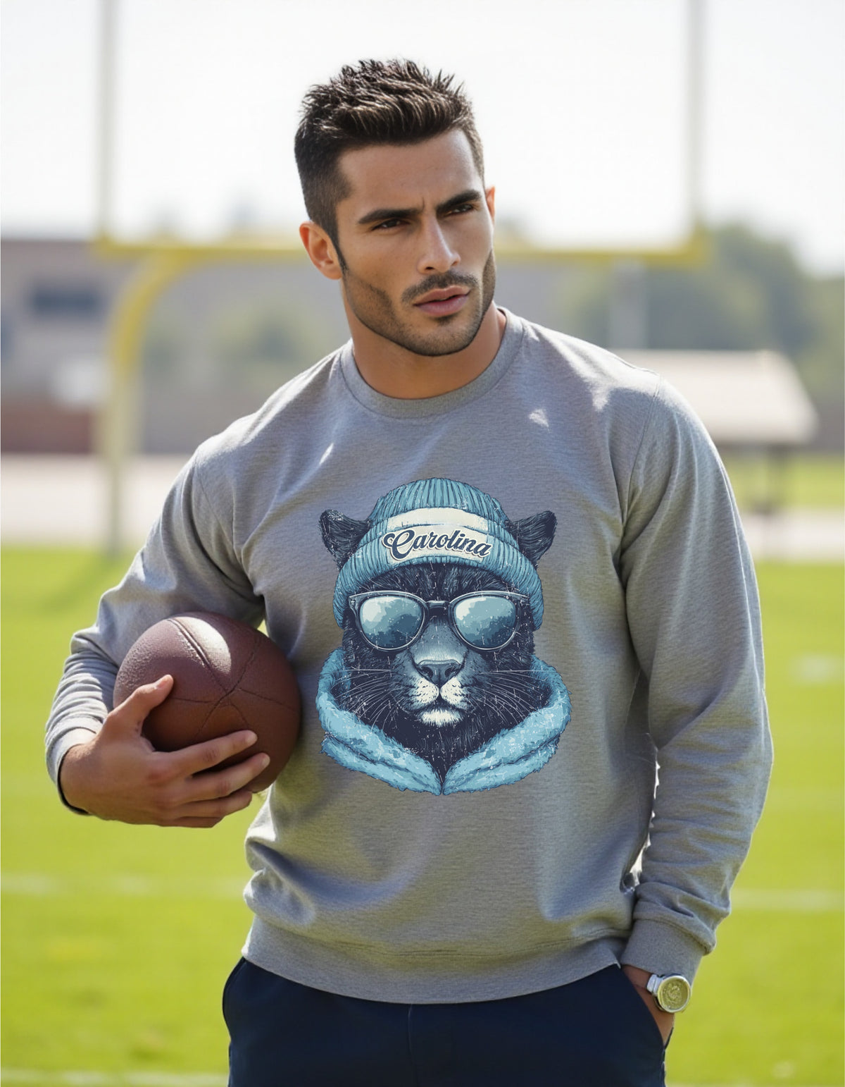 Carolina Panthers Spirit Animal crewneck sweatshirt on a male model holding a football