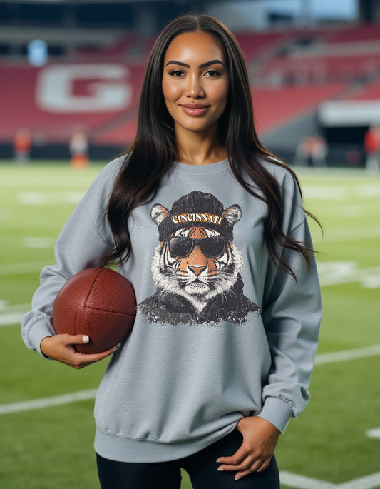 Cincinnati Bengals Spirit Animal sweatshirt on female model with football