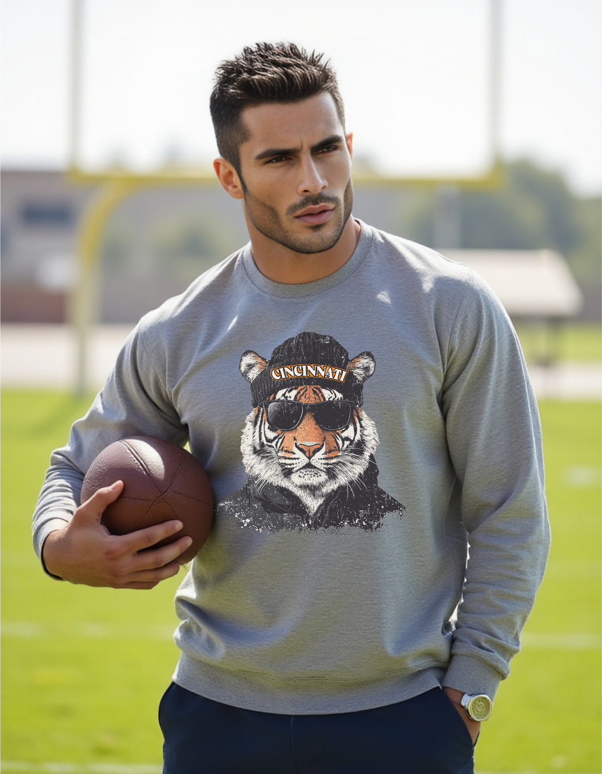 Cincinnati Bengals Spirit Animal sweatshirt on male model with football