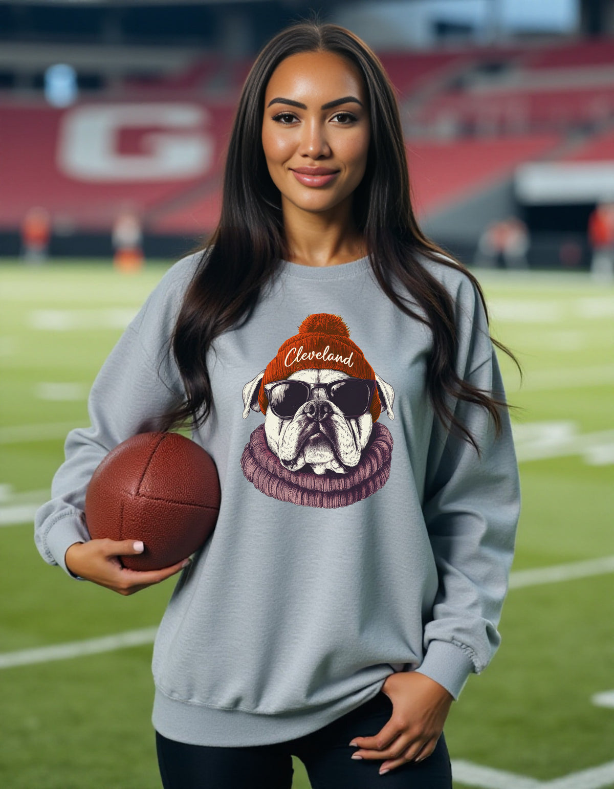 Cleveland Browns Spirit Animal sweatshirt on female model with football
