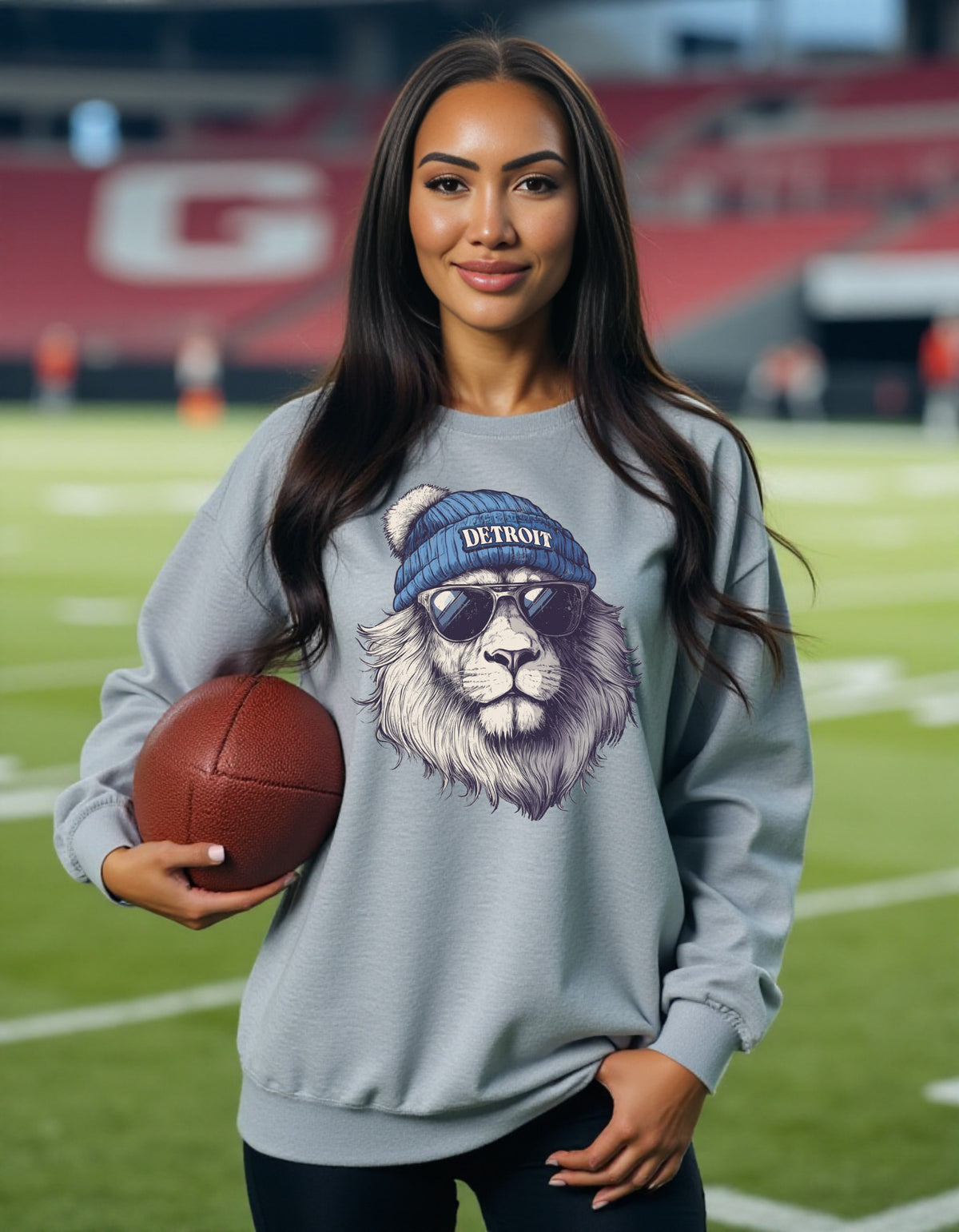 Detroit Lions Spirit Animal sweatshirt on female model with football