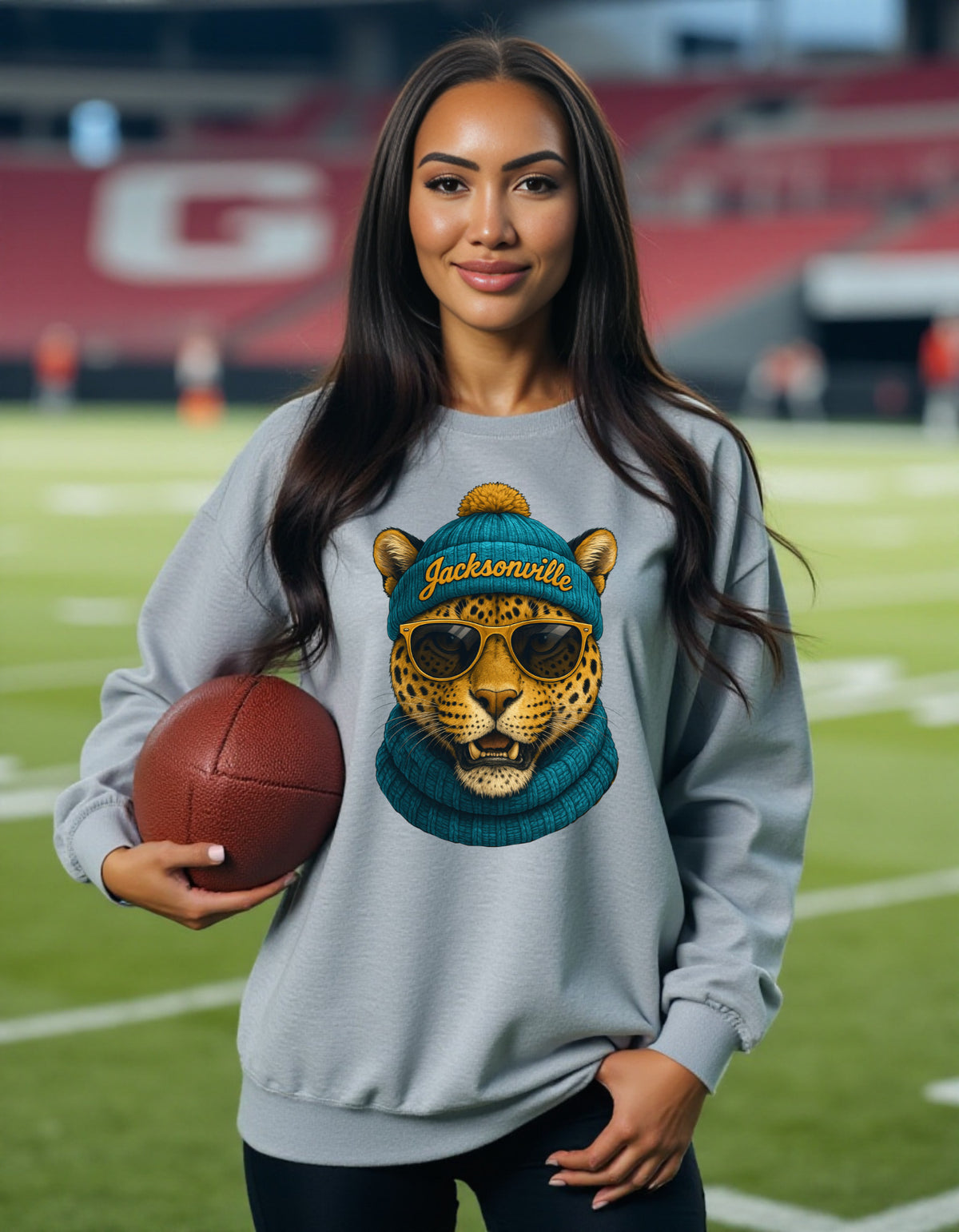 Jacksonville Jaguars Spirit Animal sweatshirt on female model with football