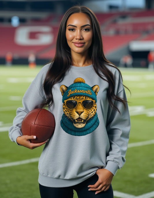 Jacksonville Jaguars Spirit Animal sweatshirt on female model with football