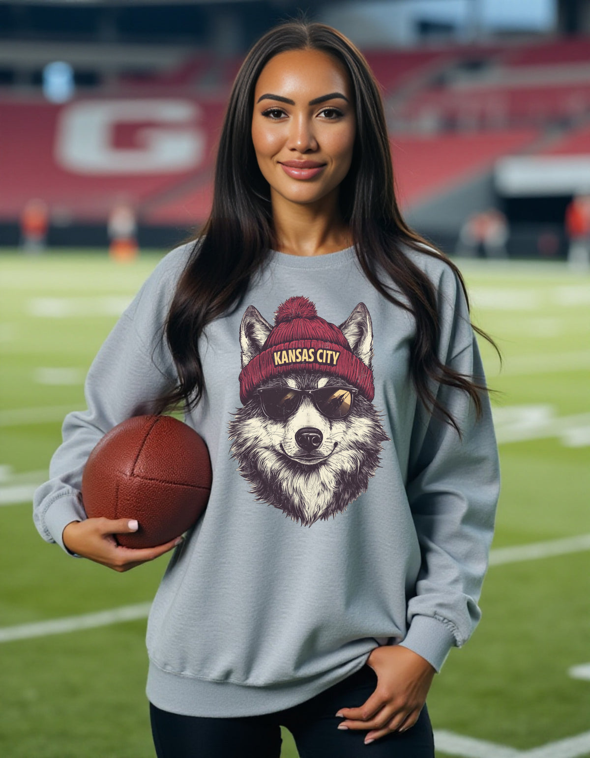Kansas City Chiefs Spirit Animal sweatshirt on female model with football