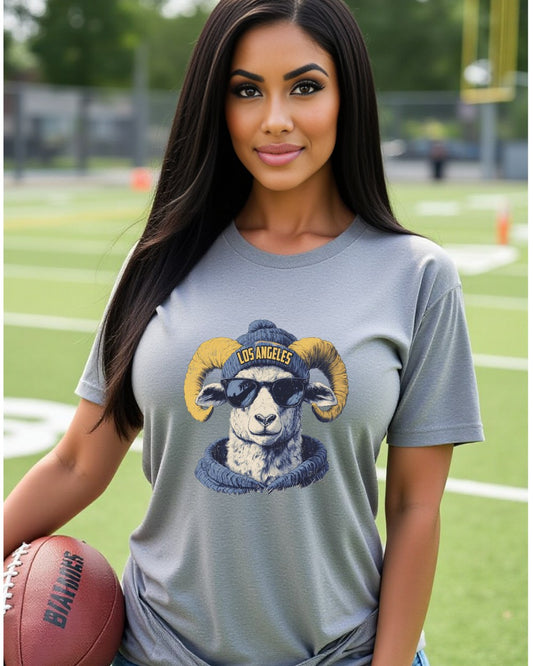 Los Angeles Rams Spirit Animal T-shirt shown on female model with football