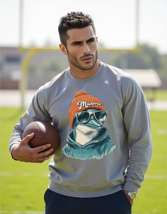 Miami Dolphins Spirit Animal sweatshirt on male model with football