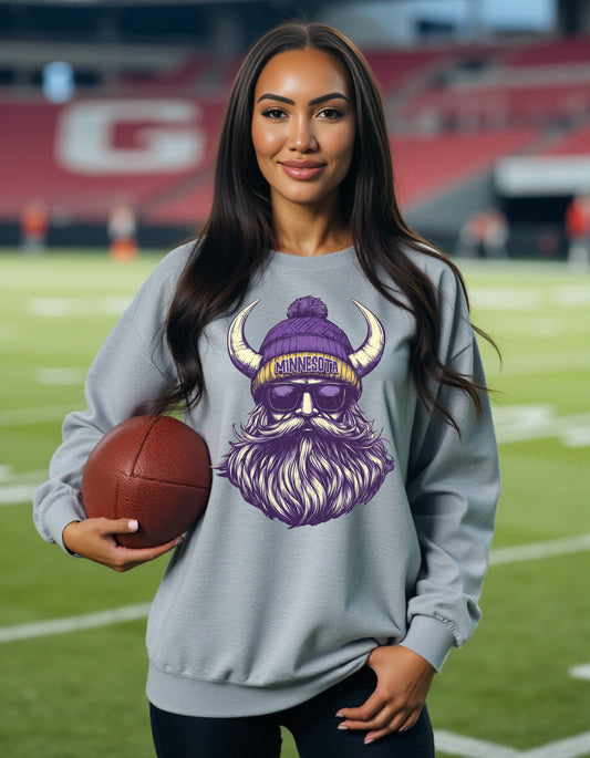 Minnesota Vikings Spirit Animal sweatshirt on female model with football
