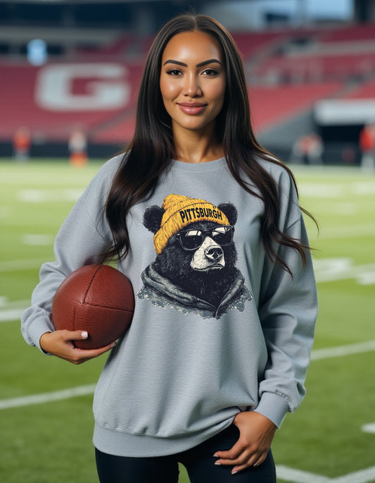 Pittsburgh Steelers Spirit Animal sweatshirt on female model with football