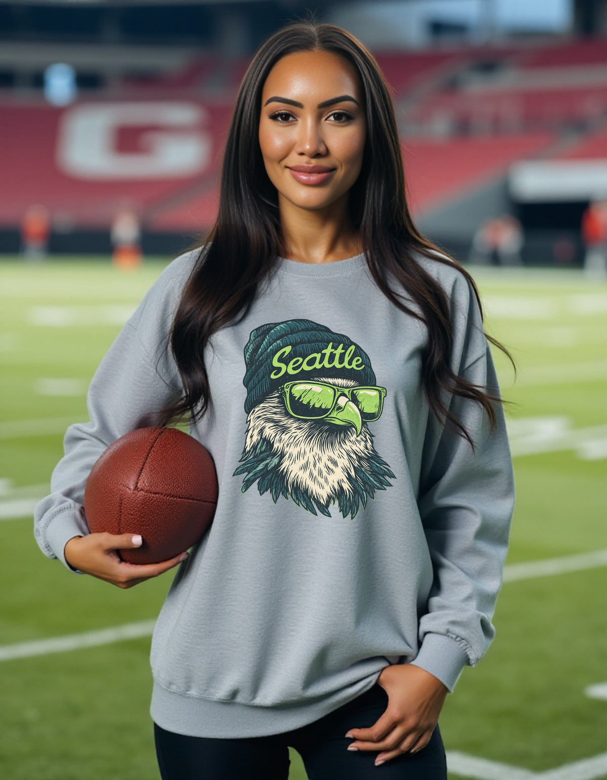 Seattle Seahawks Spirit Animal sweatshirt on female model with football