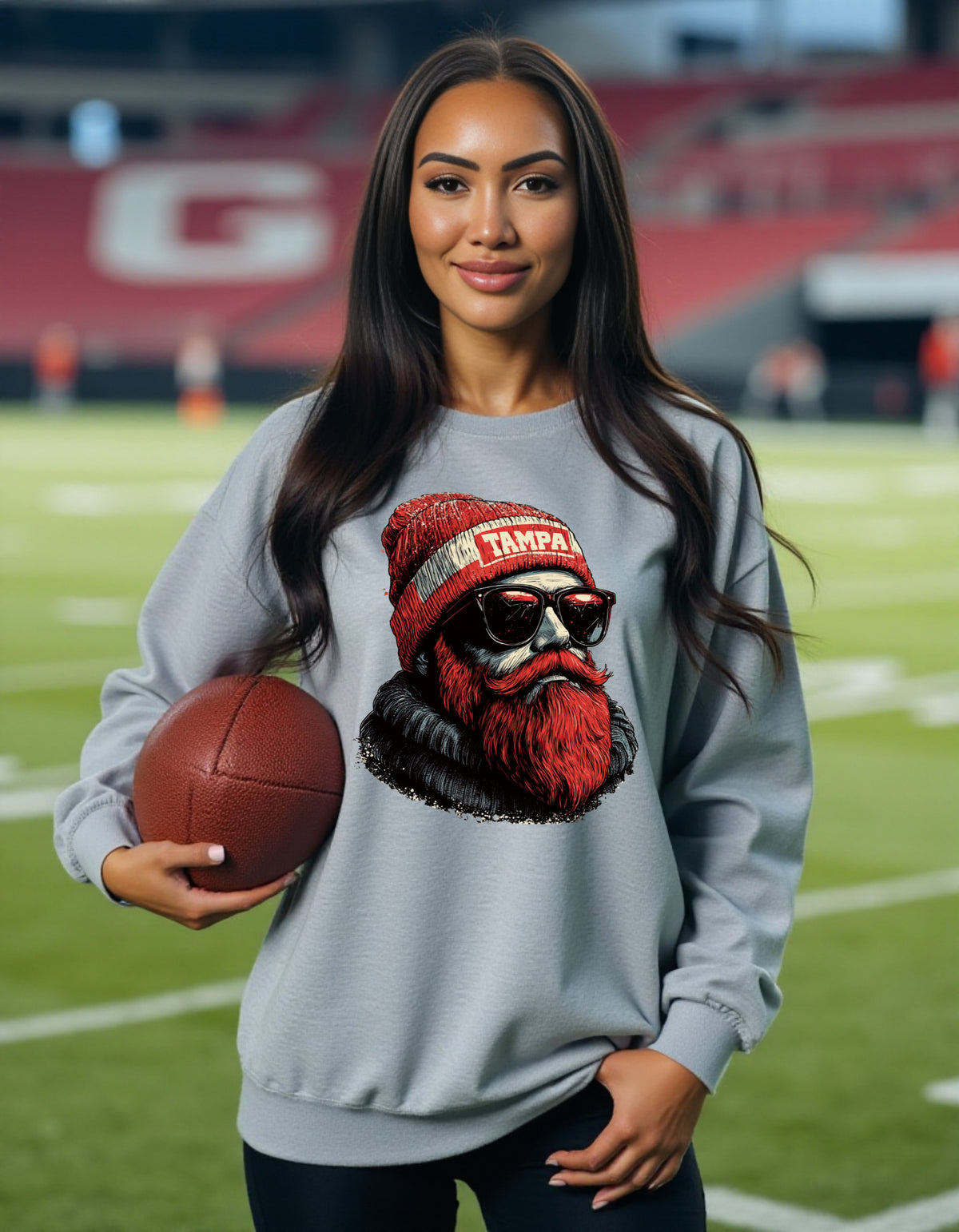 Tampa Bay Buccaneers Spirit Animal sweatshirt on female model with football