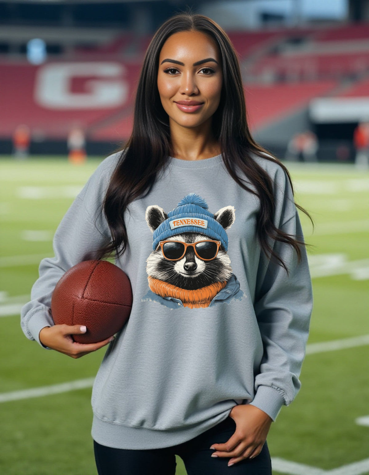 Tennessee Titans Spirit Animal sweatshirt, blue artwork, modeled by woman holding a football